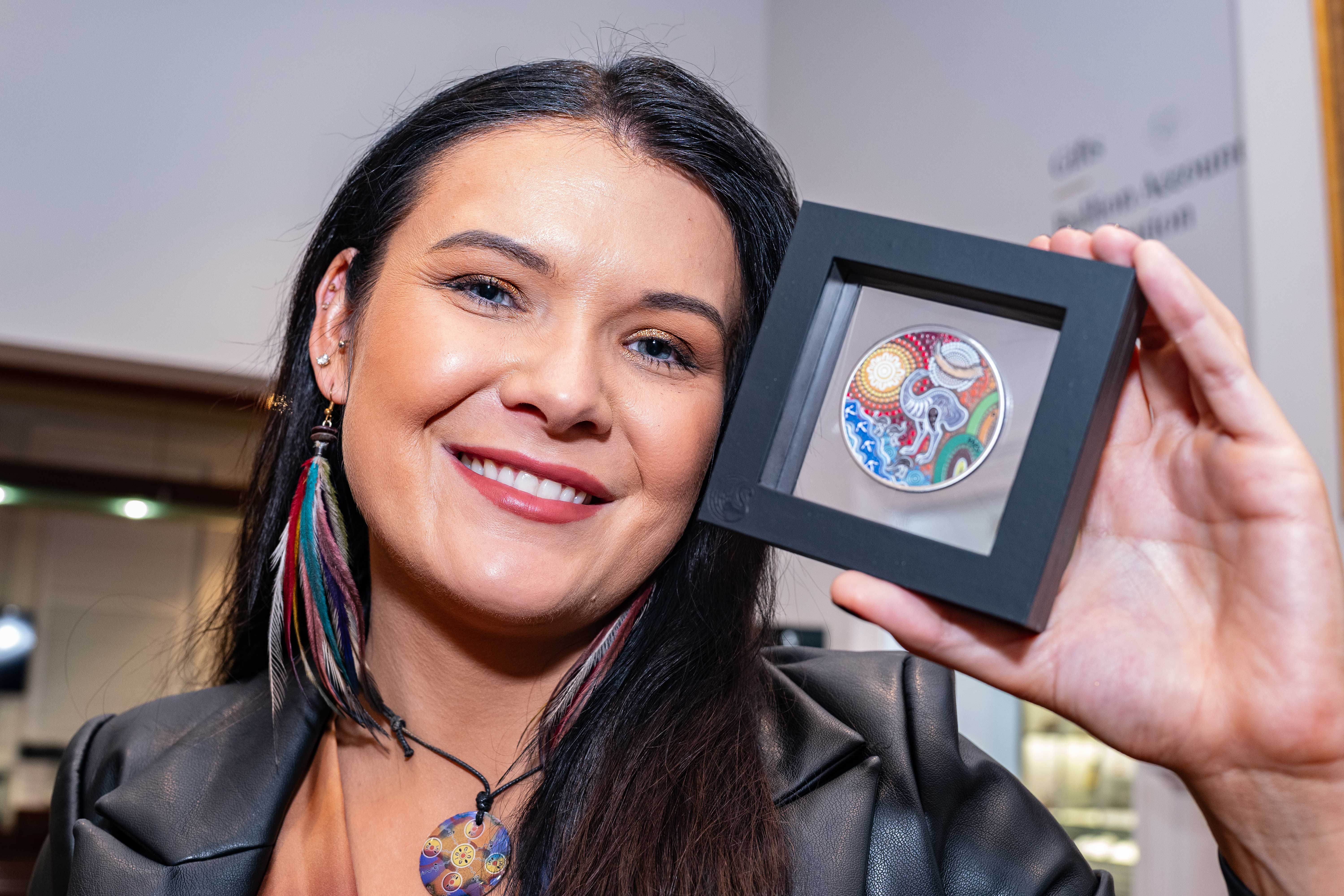 Indigenous artist, Chern'ee Sutton with her coin design